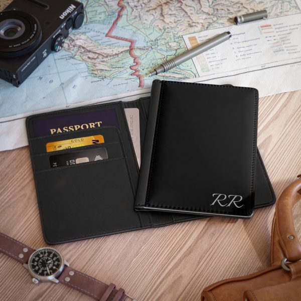 Elite Men's RFID Wallet sleek plain black bespoke passport cover with credit card sections showcased on a table opened and front cover